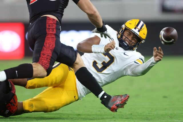A visita nº 15 da Virgínia a Cal pode ser O running back Kendrick Raphael (1) do California Golden Bears é abordado por uma gangue pelos Duke Blue Devils na segunda metade do jogo no Memorial Stadium em Berkeley, Califórnia, no sábado, 4 de outubro de 2025. Os Duke Blue Devils derrotaram o California Golden Bears 45-21. (José Carlos Fajardo/Bay Area News Group)