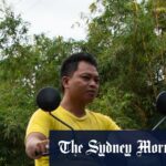 Motoristas passam por uma rachadura na estrada ao longo de uma importante rodovia na província de Cebu, causada por um terremoto anterior nas Filipinas, em 1º de outubro.