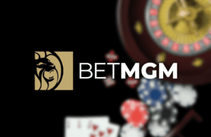 BetMGM faz parceria com BetBlocker na imprensa de apostas responsáveis BetMGM faz parceria com BetBlocker para expandir os esforços de jogo responsável e proteção do jogador. Logotipo da BetMGM exibido ao lado de imagens de cassino, incluindo fichas de pôquer, cartas de baralho e uma roda de roleta, representando jogos e apostas online.