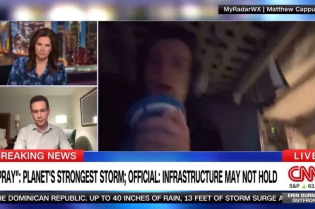 Caçador de tempestades vomita enquanto voava através do furacão Melissa Captura de tela de uma transmissão da CNN com uma âncora, um repórter e um homem se abrigando durante uma tempestade, com um noticiário sobre a tempestade mais forte do planeta.