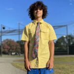 George Kahi, um entusiasmado jovem de 14 anos do time universitário de Port Washington, que se classificou para a seleção da New Balance quando ainda estava na oitava série, é um personagem da pista que opta por praticar e se exercitar com roupas sociais.