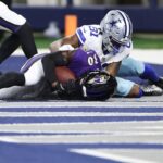 Reuben Lowery #30 of the Baltimore Ravens intercepts a pass intended for Jonathan Mingo #81 of the Dallas Cowboys