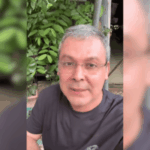Fundo preto com um vídeo vertical de mídia social no meio, do deputado federal Lindbergh Farias