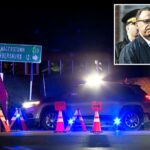 Um veículo da polícia com luzes piscando na cena do crime à noite.