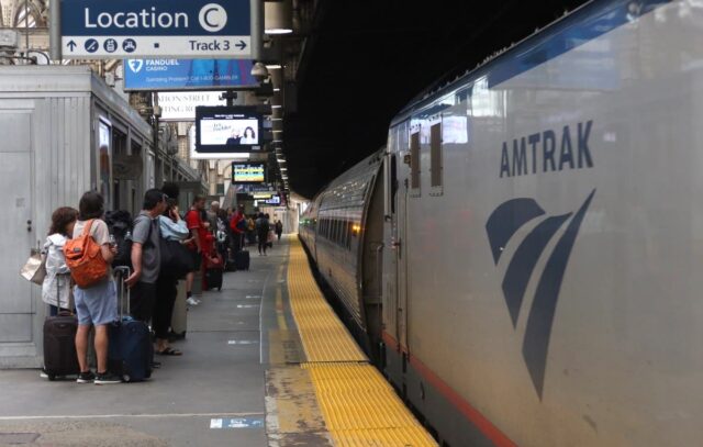 NEWARK, NJ - JUNE 14: People wait to board an Amtrak train at Penn Station on June 14, 2025, in Newark, New Jersey.