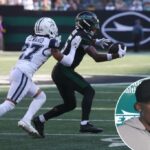 Garrett Wilson faz uma captura durante o jogo Jets-Cowboys em 5 de outubro de 2025.