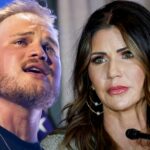 Zach Bryan e Kristi Noem Getty