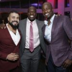 Estrela da WWE Andrade com Titus Oneil