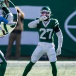 Malachi Moore, nº 27 do New York Jets, rebate depois de enfrentar Jimmy Horn Jr. nº 15 do Carolina Panthers, interrompendo uma finalização durante o 2º quarto no MetLife Stadium, domingo, 19 de outubro de 2025, em East Rutherford, NJ.