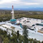 A geothermal drilling rig sits in a forest in Oregon.
