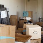 House moving, packed unpacked carton boxes, messy home