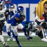 Wan'Dale Robinson (17) é abordado por Philadelphia Eagles Marcus Epps no segundo tempo no MetLife Stadium quinta-feira, 9 de outubro de 2025, em East Rutherford, NJ.