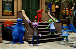 Road de gergelim é preocupante roblox Um jardim virtual 3D de cores vivas. Um avatar estilizado como um suporte de Muppet no centro.