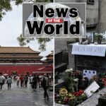 Pessoas caminham em direção à Cidade Proibida em Pequim.