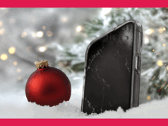 8 erros que as pessoas cometem ao matar o telefone em todas as épocas festivas Mulher sorridente preparando uma salada em uma cozinha ao lado do mascote Android usando chapéu de chef, cercada por vegetais frescos e itens de cozinha