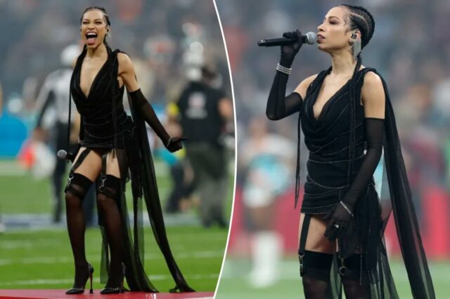 A cantora Karina Pasian bateu na roupa durante o hino A cantora Karina Pasian, dos EUA, se prepara para cantar o hino nacional durante a partida da NFL entre Miami Dolphins e Washington Commanders no Estádio Santiago Bernabeu, em Madrid, em 16 de novembro de 2025. (
