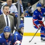 O defensor do New York Rangers, Will Borgen (17), patina com o disco.