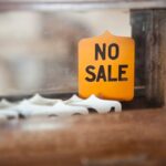 A 'NO SALE' sign on an Antique Cash Register