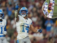 Amon-Ra St. Brown multado por socar jogador do Commanders em momento selvagem Amon-Ra St. Brown do Detroit Lions comemora um touchdown.