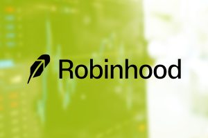 As finanças do Robinhood Q3 destacam a parceria Kalshi com As finanças do Robinhood Q3 destacam a parceria Kalshi com crescimento de 100%. Logotipo do Robinhood no topo da imagem genérica dos gráficos de previsão do mercado