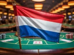Autoridade holandesa de jogos de azar emite aviso à Tulipa Entertainment por violações de AML Uma fotografia da bandeira da Holanda exibida com destaque em primeiro plano, de um cassino. Autoridade holandesa de jogos de azar emite aviso à Tulipa Entertainment por violações