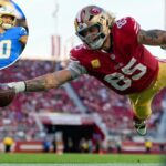 O tight end do San Francisco 49ers, George Kittle (85), marca um touchdown contra o Los Angeles Rams.