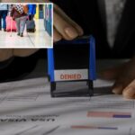 Viajantes andando com bagagem por uma estação de trem em Londres.