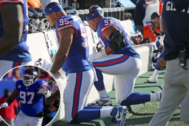 Roy Robertson-Harris #95 e Dexter Lawrence II #97 do New York Giants no banco durante o segundo quarto.