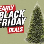 Árvore de Natal artificial pré-iluminada com suporte de metal.