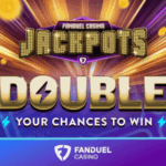 FanDuel lança novo recurso de jackpots de cassino em Michigan, Nova Jersey e Pensilvânia. Gráfico promocional do FanDuel Casino com o título 'Jackpots' e um grande texto dourado dizendo 'Double Your Chances to Win', apresentando faixas de luz brilhantes, moedas de ouro e o logotipo do FanDuel Casino na parte inferior