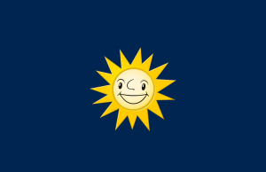 Grupo Merkur adquire 11 fliperamas na Espanha e assume máquinas de jogos em 108 bares Fundo azul profundo com o logotipo do Grupo Merkur no centro, como um sol amarelo.