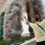 Incêndio destrói complexo habitacional de Hong Kong, matando pelo menos 13 pessoas e outros presos