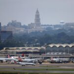 airplanes wait on the ground at Reagan National Airport.