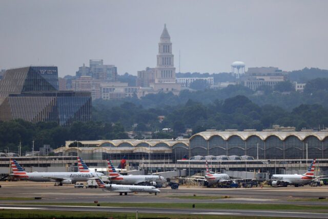 airplanes wait on the ground at Reagan National Airport.