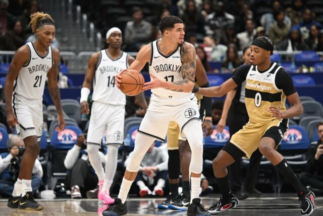 Michael Porter Jr. atender ao apelo por mais jogadas compensa O atacante do Brooklyn Nets, Michael Porter Jr. (17), tenta passar a bola na frente do armador do Washington Wizards, Bilal Coulibaly (0), durante o terceiro quarto na Capital One Arena.