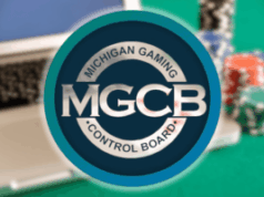 Michigan ordena que três cassinos online interrompam imediatamente as operações ilegais em todo o estado Michigan ordena que três cassinos online interrompam imediatamente as operações ilegais em todo o estado. Logotipo do Michigan Gaming Control Board exibido com destaque na frente de um fundo desfocado mostrando um laptop e fichas de cassino coloridas.
