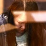 Uma foto capturada de Hakyung Lee na Safe Store depois que ela matou seus filhos Yuna e Minu Jo.