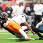 Houston Texans QB C.J. Stroud takes a hit from Denver Broncos CB Kris Abrams-Draine