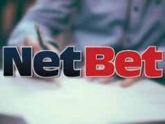 NetBet multado em US$ 850 mil após falhas em AML e responsabilidade social Logotipo da NetBet Enterprises em um fundo de documento legal. NetBet multado em US$ 850 mil após falhas em AML e responsabilidade social
