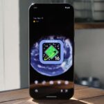 Mascote do Android com botão liga / desliga desligado, parcialmente escondido atrás do número 16, simbolizando recursos desativados do Android 16.