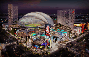 O setor de cassinos de Bally e o mercado do Reino Unido prosperam, revela o relatório do terceiro trimestre Renderização da imagem da Bally's Corp em Las Vegas, edifícios ao redor da placa da Bally e do estádio no meio.