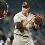 O arremessador substituto do San Diego Padres, Craig Stammen, de uniforme e boné de beisebol, segurando uma luva.