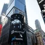 The Peloton logo is displayed, center, on the Nasdaq MarketSite
