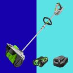 Uma pá de neve com baterias ao lado.