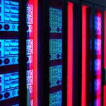 Servers glow in a data center rack.