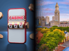 SGLA testemunha perante o comitê de Massachusetts sobre jogos ‘Social Plus’ SGLA testemunha perante o comitê de Massachusetts sobre jogos 'Social Plus'. Uma imagem em tela dividida mostrando uma ilustração 3D de uma máquina caça-níqueis móvel à esquerda, exibindo a palavra 'CASINO' e uma combinação vencedora de 777 com moedas flutuando ao redor, e à direita uma vista panorâmica do centro de Boston com edifícios históricos, árvores verdes e a Custom House Tower sob um céu colorido.