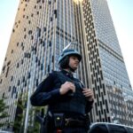 NYPD officers stand guard outside of 26 Federal Plaza in NYC on October 21, 2025. (Photo by Adam Gray/Getty Images)
