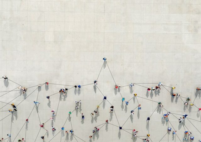 People connected by data points to show a graph.