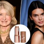 L'Oréal Paris Lumi Bronze Le Stick Soleil, um tubo aberto de bastão bronzeador com tampa ao lado.