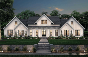 Empreiteiro da Ankeny condenado à prisão após jogar fora o dinheiro dos clientes Empreiteiro de Ankeny condenado à prisão após jogar fora o dinheiro dos clientes. Grande casa branca moderna em estilo de fazenda com telhado de metal preto, janelas simétricas, jardim paisagístico e passarela de pedra ao entardecer.